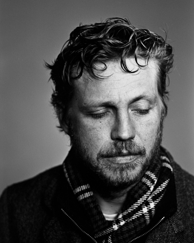 Portrait of a man looking down bw