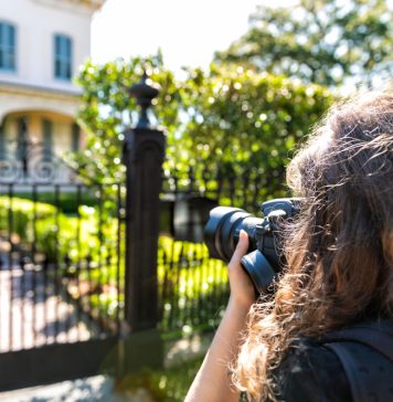 Tips for Starting a Real Estate Photography Business real estate photographer taking picture of house