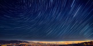 star trails over a city