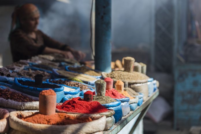 Woman selling spices at a market