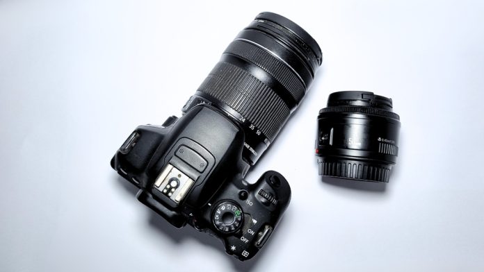 camera with a zoom lens and a prime lens