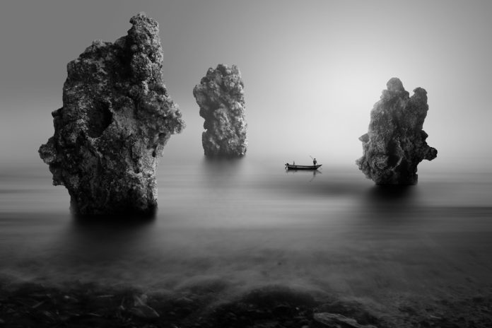 fisherman on the stone beach