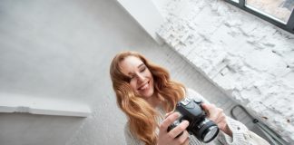 young female photographer with dslr