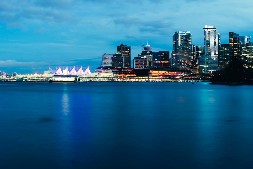 view of a city at night from across the water