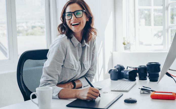 photographer working at her office desk