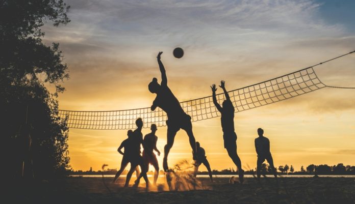 silhouette of people playing Beach Volley ball