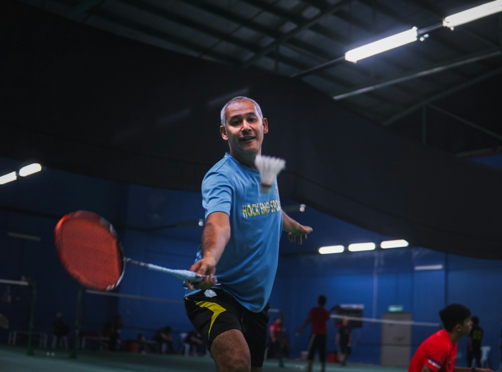 Man playing badminton