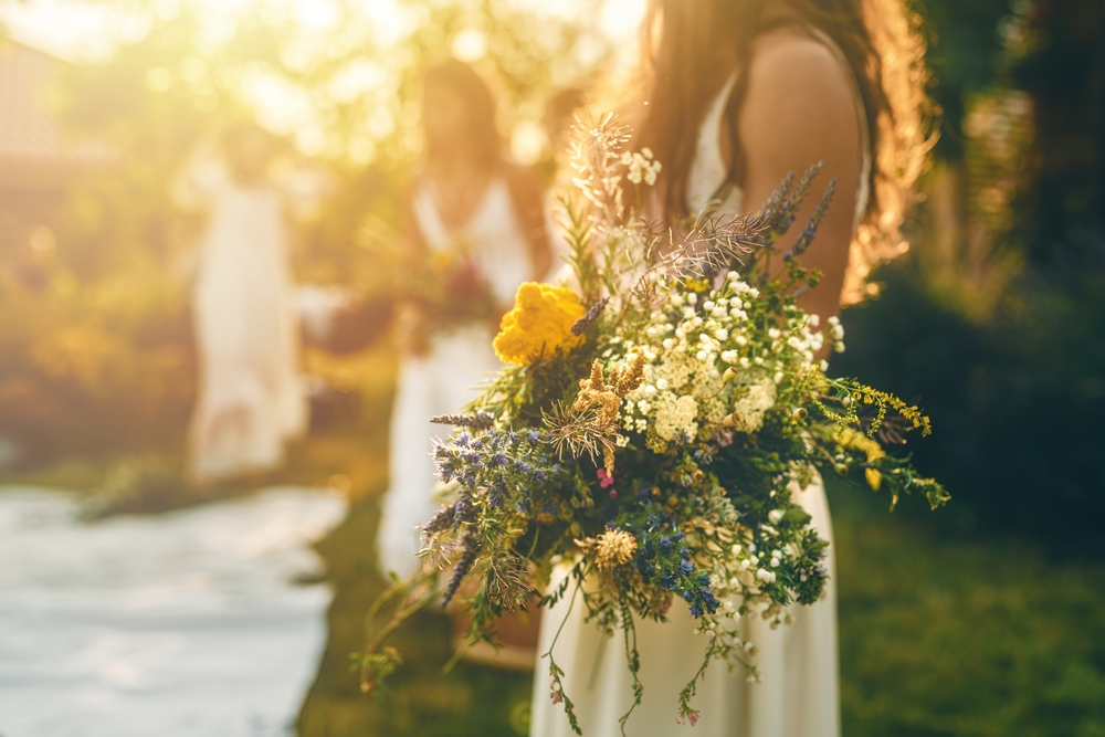 bouquet in hand at sunset