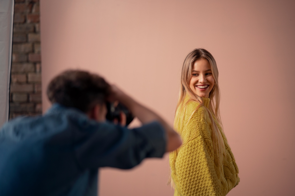 Woman in yellow sweater smile for the camera