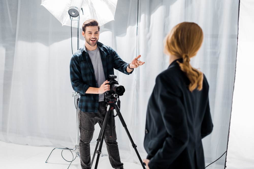 Photographer talking to his model