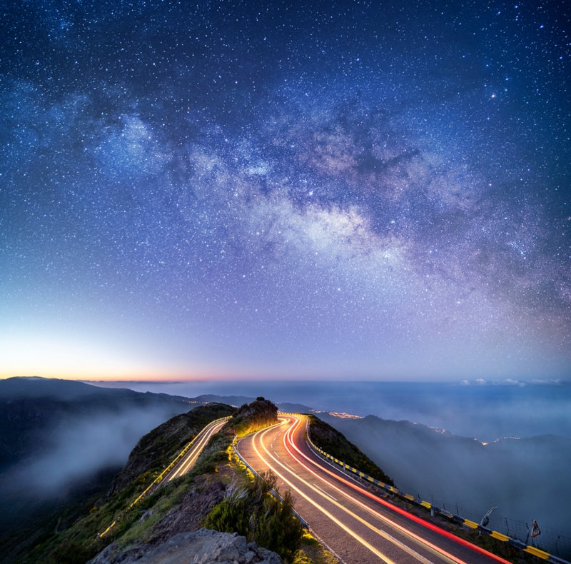 Astrophotography shot of the milky way over a road