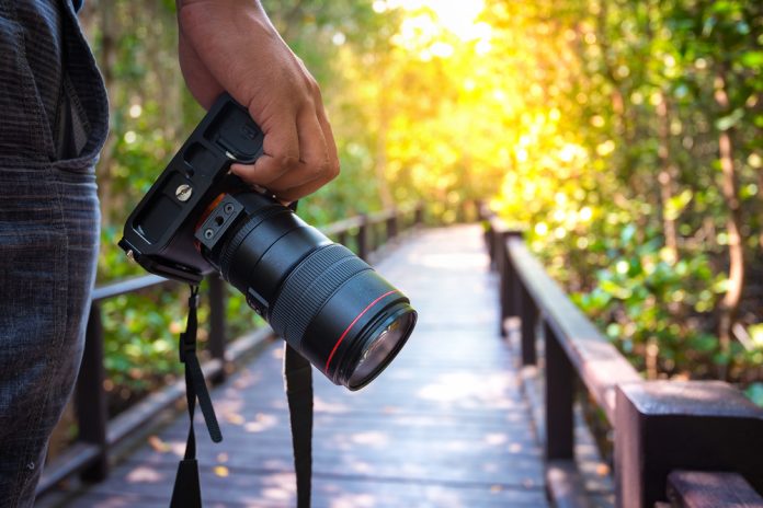 photographer holding his camera.