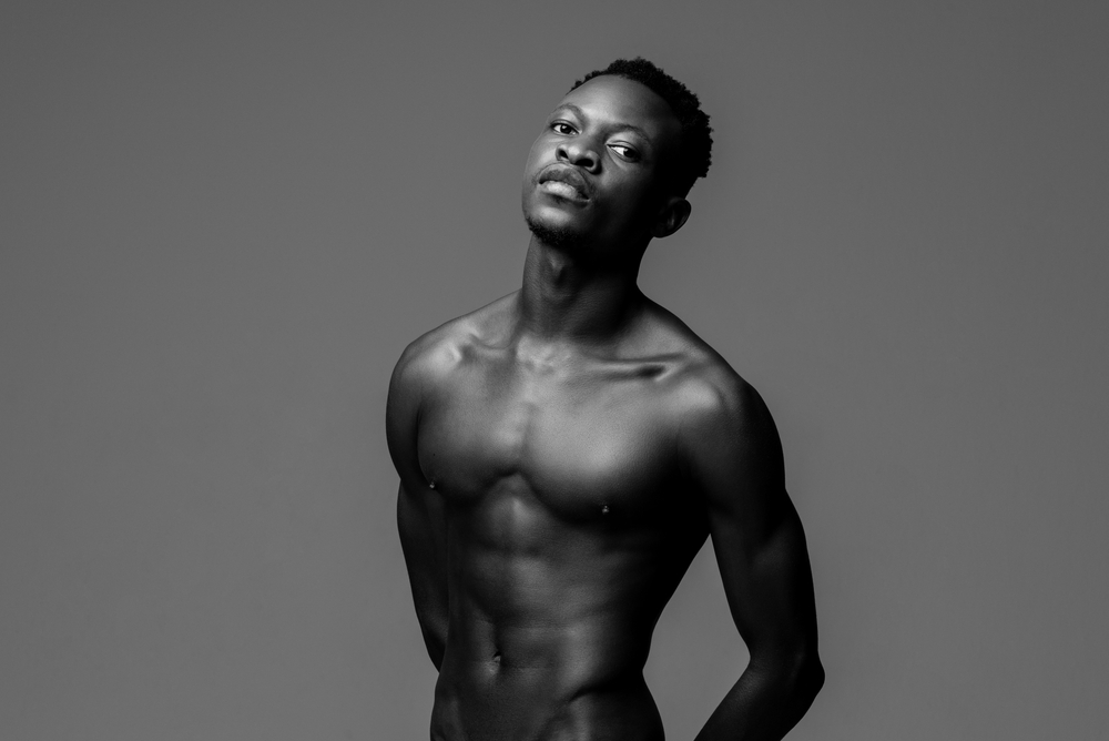 nude young lean fit African man