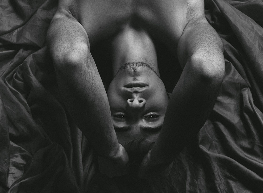 nude male posing for a photo