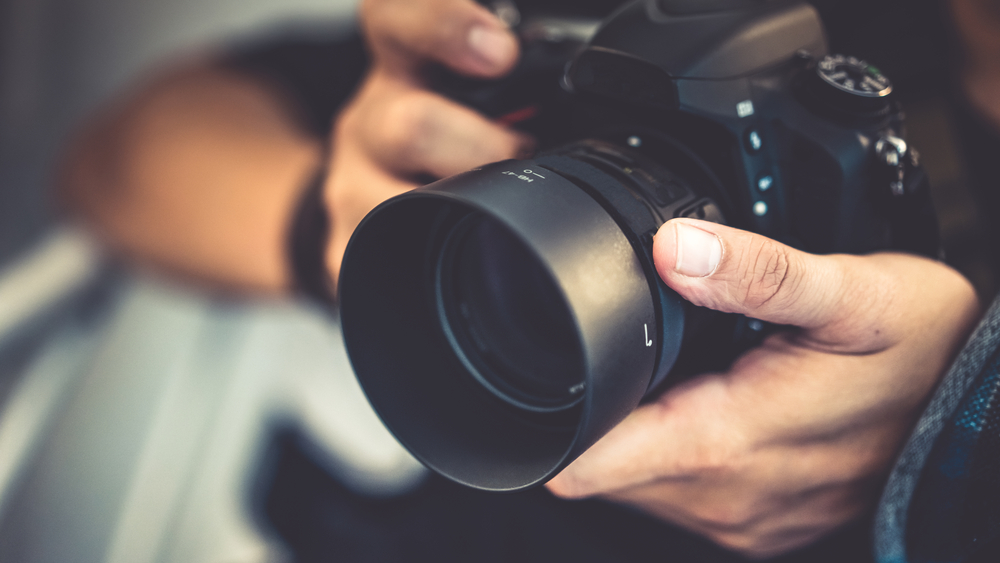 Close up of hands using a camera