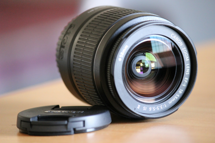 Canon 18-55 mm lens on a table Canon 18-55 mm lens on a table