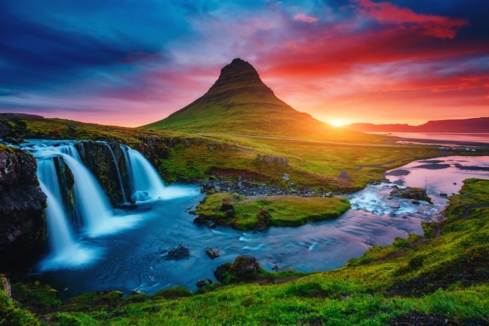 Kirkjufell volcano and waterfalls at sunset Kirkjufell volcano and waterfalls at sunset