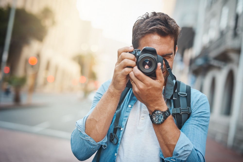 Photographer taking photos in a city