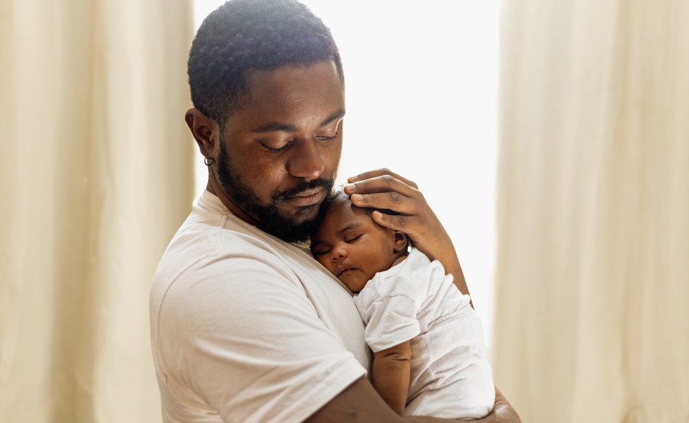 Father holding his newborn baby
