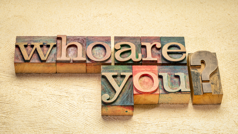 letterpress wood type blocks stained by color inks saying Who are you