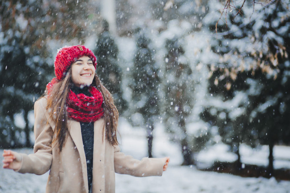 woman in a red hat in the snow