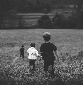 How to Turn Portrait Sessions Into Passive Income black and white portrait of three boys