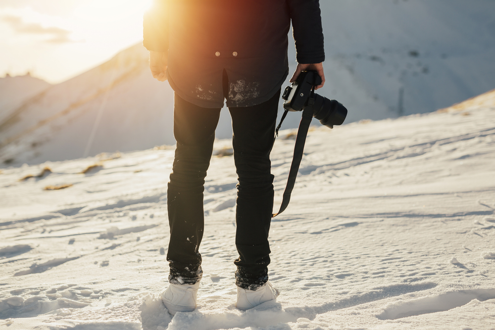 winter photographer with camera