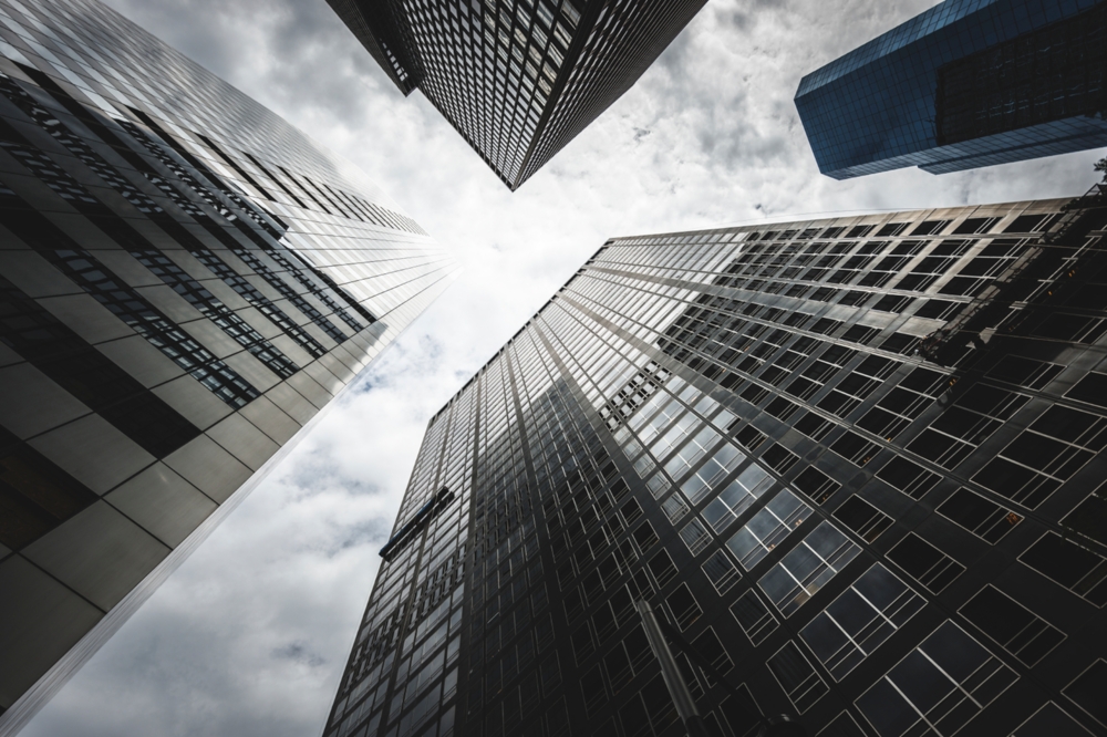 looking up through skyscrapers