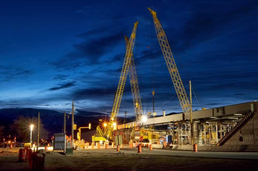 Construction site with cranes at night