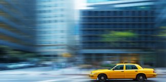 taxi cab in the city panning movement