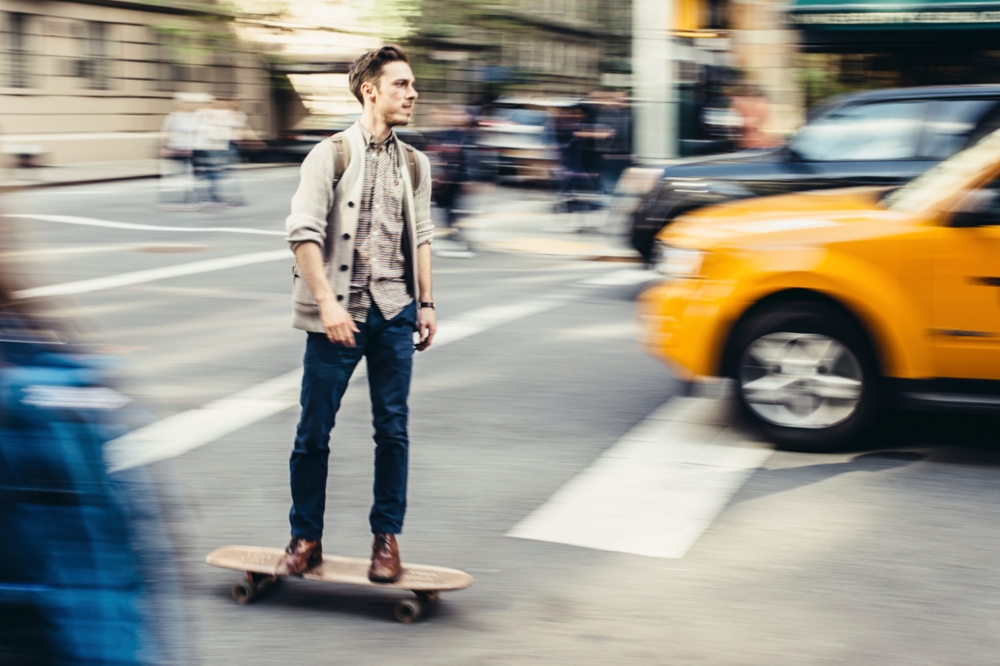 man on a skateboard panning movement
