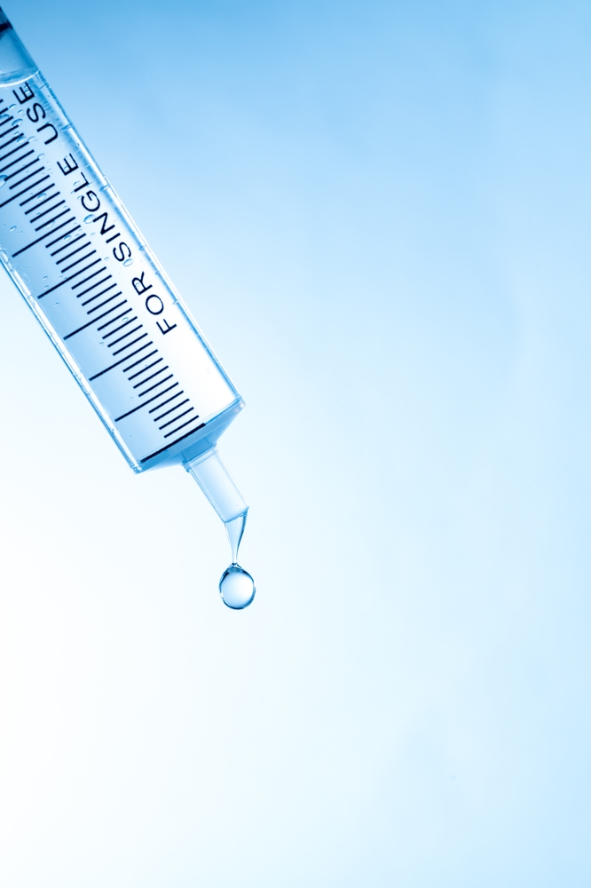 Droplets falling from a syringe-shaped dropper