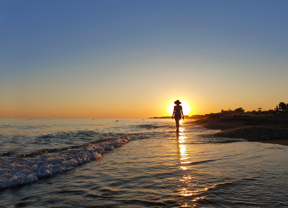 silhouette of woman at beach