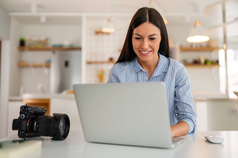 Photographer using a laptop
