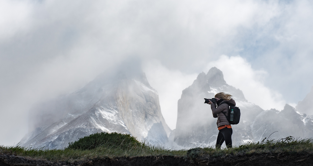 female photographer in the mountains