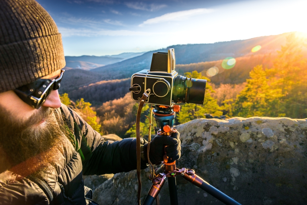 man using medium format camera