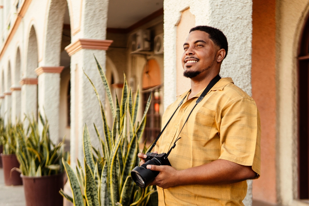 Photographer standing in front of a building